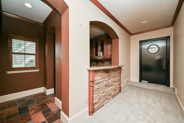 42 Lake Sterling Gate Dr, Spring, TX 77379 - entryway featuring ornamental molding, recessed lighting, arched walkways, and dark stone finish flooring