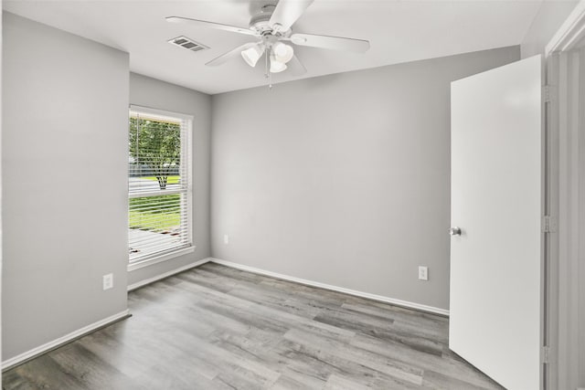 3445 Van Ness Dr, Alvin, TX 77511 - empty room with a ceiling fan and wood finished floors