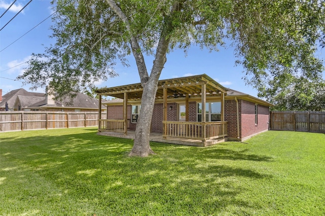 3445 Van Ness Dr, Alvin, TX 77511 - rear view of property featuring a fenced backyard, brick siding, a wooden deck, and a pergola