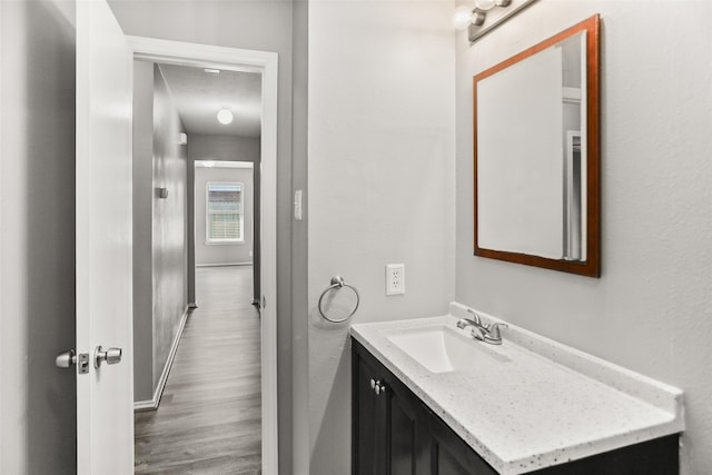 3445 Van Ness Dr, Alvin, TX 77511 - bathroom with wood finished floors and vanity