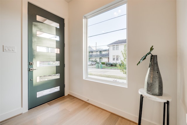 5705 Feagan St, Houston, TX 77007 - entryway with light wood finished floors and baseboards