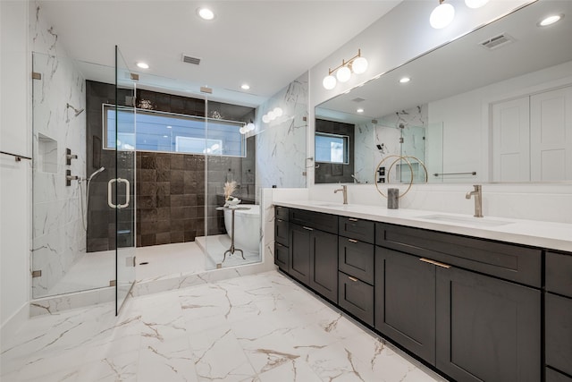 5705 Feagan St, Houston, TX 77007 - full bath with double vanity, a marble finish shower, recessed lighting, and marble finish floors