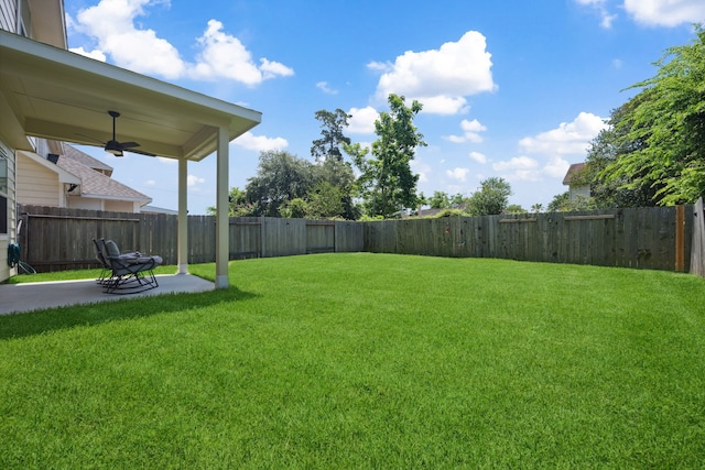 11134 Sun River Falls Dr, Humble, TX 77396 - fenced backyard with a patio area and ceiling fan
