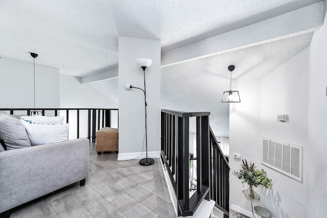 18446 N Willow Bluff Rd, Katy, TX 77449 - staircase with a textured ceiling and vaulted ceiling