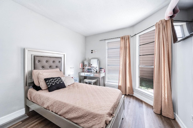 18446 N Willow Bluff Rd, Katy, TX 77449 - bedroom with wood finished floors