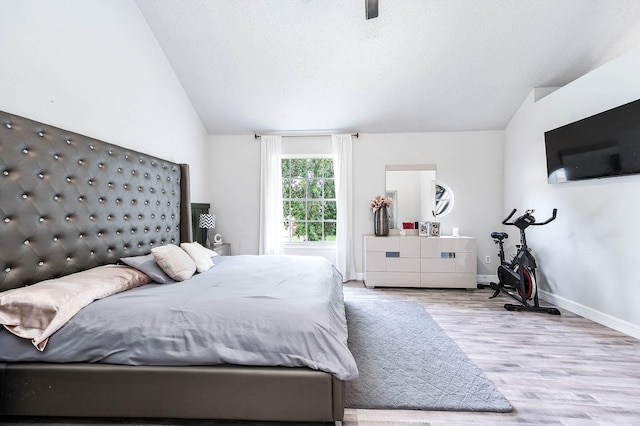 18446 N Willow Bluff Rd, Katy, TX 77449 - bedroom with vaulted ceiling and wood finished floors