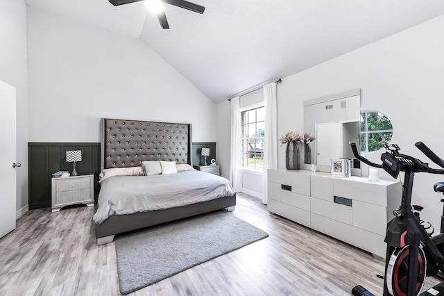 18446 N Willow Bluff Rd, Katy, TX 77449 - bedroom with high vaulted ceiling, light wood-type flooring, and a ceiling fan