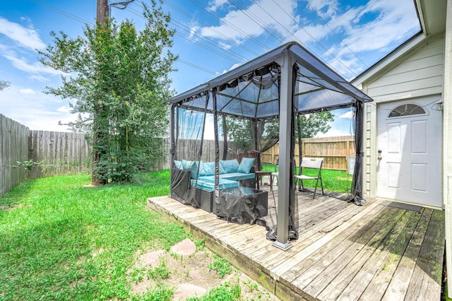 18446 N Willow Bluff Rd, Katy, TX 77449 - wooden terrace featuring a gazebo, a fenced backyard, and outdoor lounge area