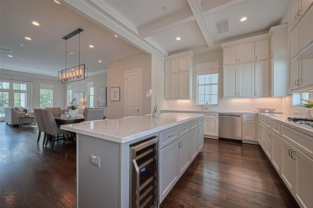 817 Blackshire Ln, Houston, TX 77055 - kitchen featuring beverage cooler, dishwasher, backsplash, white cabinets, and recessed lighting