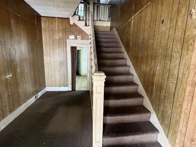1511 37th St, Galveston, TX 77550 - staircase featuring wood walls