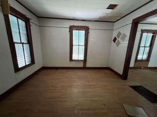 1511 37th St, Galveston, TX 77550 - empty room with wood finished floors and baseboards