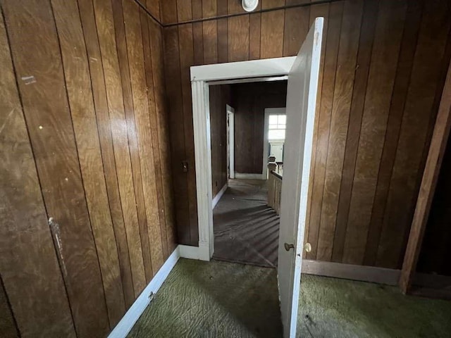 1511 37th St, Galveston, TX 77550 - hall featuring wooden walls and carpet flooring