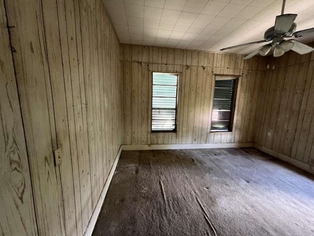 1511 37th St, Galveston, TX 77550 - carpeted empty room with wood walls and a ceiling fan