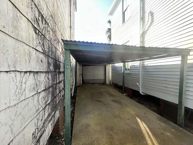 1511 37th St, Galveston, TX 77550 - view of vehicle parking with a garage, driveway, and a carport