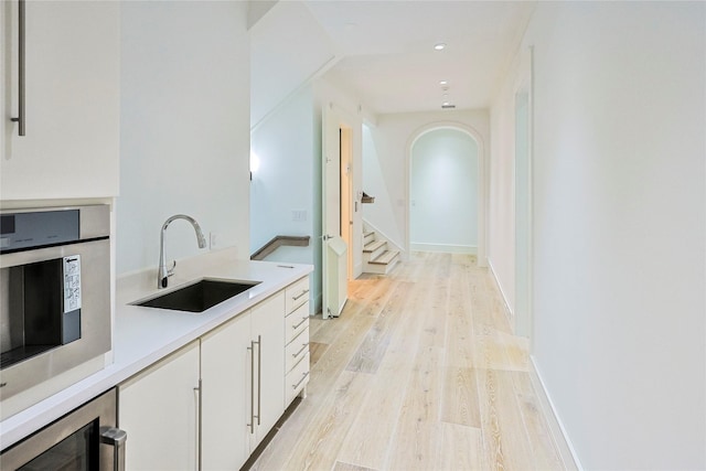 2425 E Seaside Dr, Galveston, TX 77550 - hallway with light wood-type flooring and recessed lighting