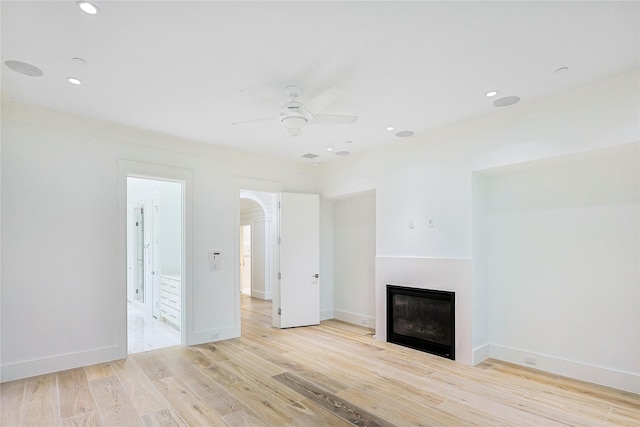 2425 E Seaside Dr, Galveston, TX 77550 - unfurnished living room featuring a ceiling fan, a glass covered fireplace, light wood-style floors, and recessed lighting