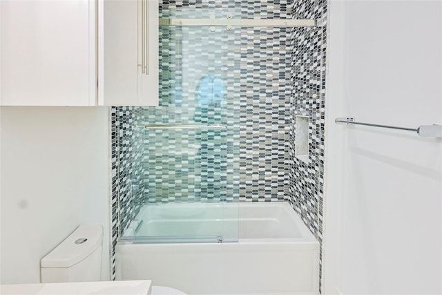 2425 E Seaside Dr, Galveston, TX 77550 - bathroom with toilet and combined bath / shower with glass door