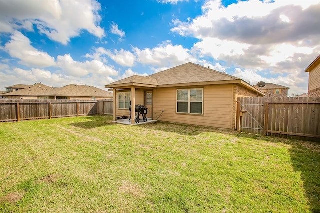 919 Bright Lotus Ln, Rosharon, TX 77583 - back of house featuring a fenced backyard and a patio