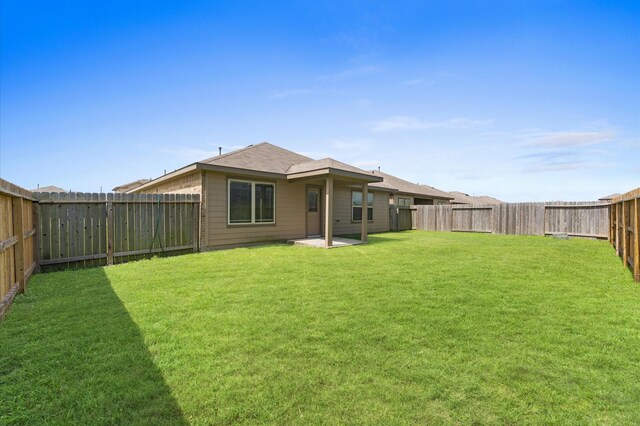 919 Bright Lotus Ln, Rosharon, TX 77583 - back of property with a fenced backyard and a patio area