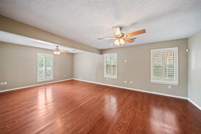 19011 Oakway Dr, Spring, TX 77388 - spare room featuring ceiling fan, healthy amount of natural light, wood finished floors, and a textured ceiling