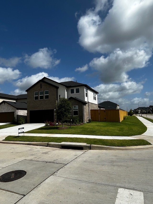 1235 Buffalo Run, Tomball, TX 77375 - traditional-style house featuring a garage, driveway, and brick siding