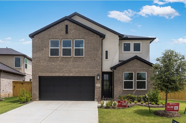 1235 Buffalo Run, Tomball, TX 77375 - view of front of property with brick siding, a garage, concrete driveway, and stucco siding