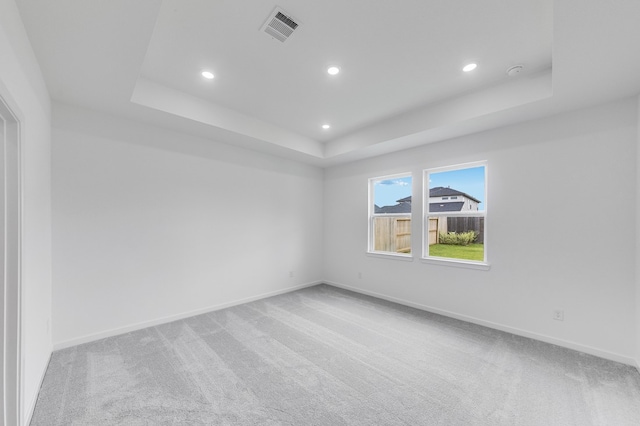 1235 Buffalo Run, Tomball, TX 77375 - spare room featuring a raised ceiling, recessed lighting, carpet flooring, and a smoke detector