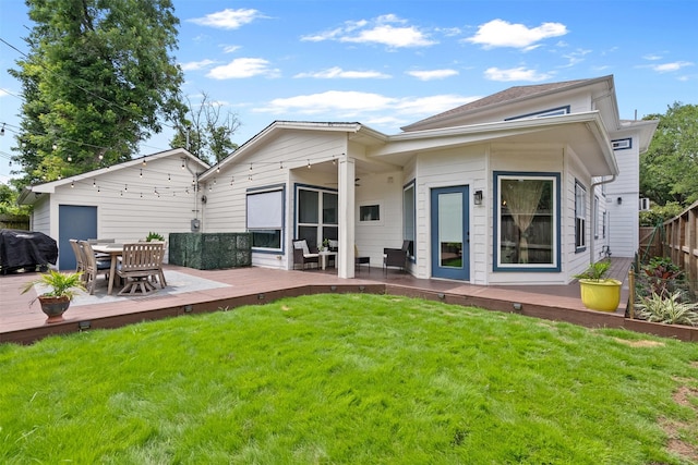 4503 Mckinney St, Houston, TX 77023 - back of property featuring a wooden deck and outdoor dining space