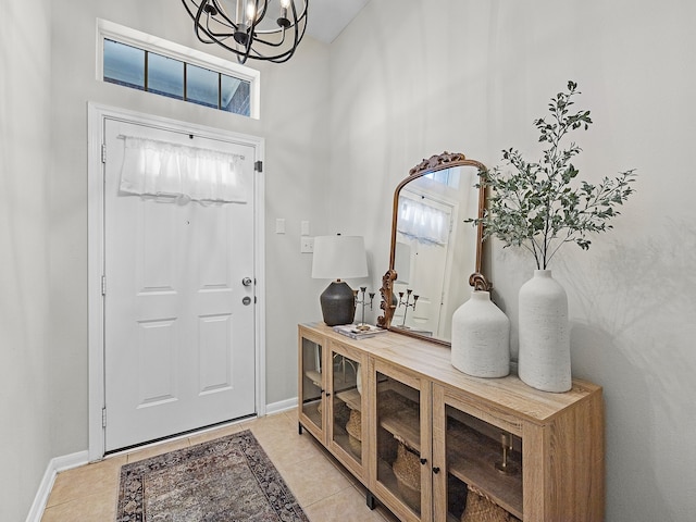 13022 Echo Landing Dr, Houston, TX 77070 - foyer with light tile patterned floors, a chandelier, and healthy amount of natural light
