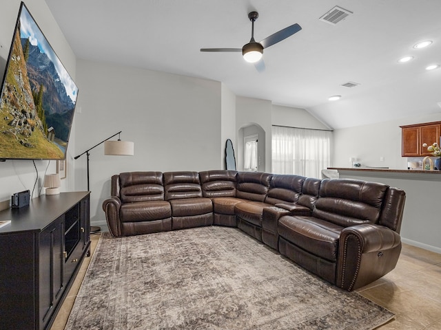 13022 Echo Landing Dr, Houston, TX 77070 - living area featuring vaulted ceiling, a ceiling fan, arched walkways, recessed lighting, and light tile patterned floors