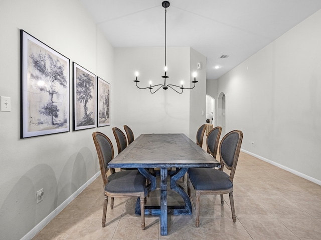 13022 Echo Landing Dr, Houston, TX 77070 - dining area featuring arched walkways, a chandelier, and light tile patterned floors