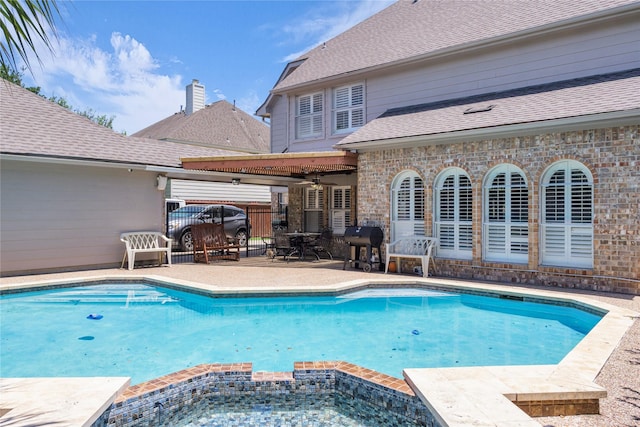 1414 Pine Meadow Ct, Pearland, TX 77581 - view of swimming pool featuring ceiling fan, a patio area, a pool with connected hot tub, and grilling area