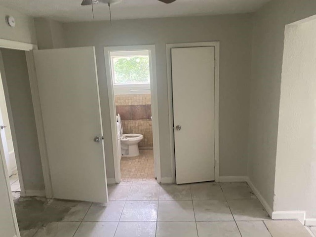15626 Corsair Rd, Houston, TX 77053 - unfurnished bedroom featuring light tile patterned flooring and ensuite bathroom
