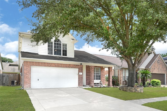 20014 Coyote Ridge Ln, Katy, TX 77449 - traditional-style home featuring brick siding, concrete driveway, and a garage