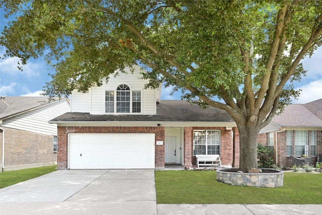 20014 Coyote Ridge Ln, Katy, TX 77449 - traditional-style home featuring brick siding, concrete driveway, a front yard, and an attached garage