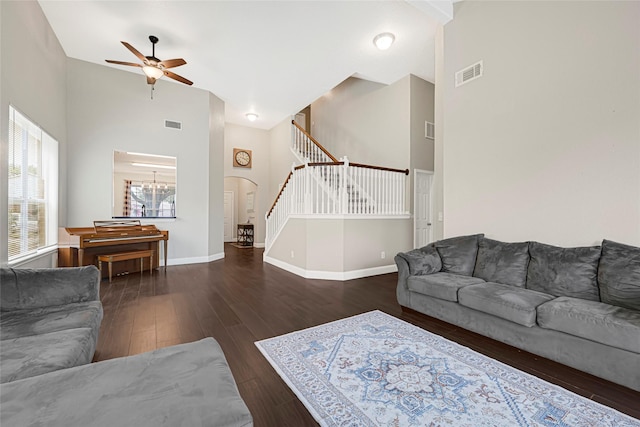 20014 Coyote Ridge Ln, Katy, TX 77449 - living area featuring stairs, high vaulted ceiling, wood finished floors, a ceiling fan, and arched walkways