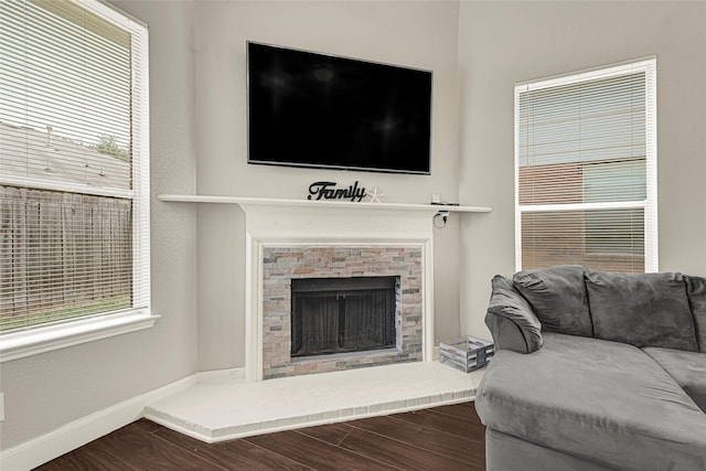 20014 Coyote Ridge Ln, Katy, TX 77449 - living room with a fireplace with raised hearth, plenty of natural light, and wood finished floors