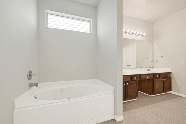 20014 Coyote Ridge Ln, Katy, TX 77449 - bathroom with vanity and a tub with jets