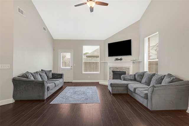 20014 Coyote Ridge Ln, Katy, TX 77449 - living area featuring high vaulted ceiling, a ceiling fan, a fireplace with raised hearth, and dark wood-style flooring