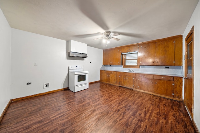 523 Main St, La Marque, TX 77568 - kitchen featuring electric stove, under cabinet range hood, brown cabinetry, and a ceiling fan