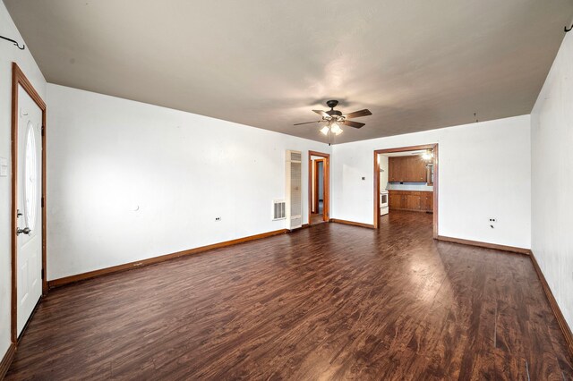 523 Main St, La Marque, TX 77568 - unfurnished room featuring dark wood-style flooring and a ceiling fan
