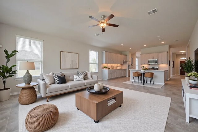 8326 Erasmus Landing Ct, Houston, TX 77044 - living area with ceiling fan and recessed lighting