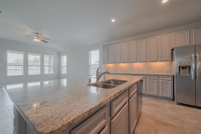 8326 Erasmus Landing Ct, Houston, TX 77044 - kitchen with appliances with stainless steel finishes, ceiling fan, an island with sink, decorative backsplash, and recessed lighting