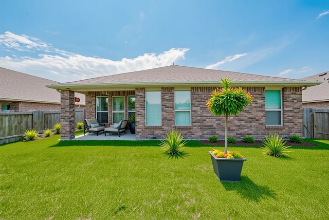 8326 Erasmus Landing Ct, Houston, TX 77044 - back of house featuring a fenced backyard, a patio, brick siding, and outdoor lounge area