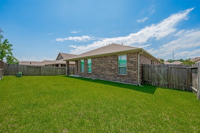 8326 Erasmus Landing Ct, Houston, TX 77044 - back of house with brick siding and a fenced backyard