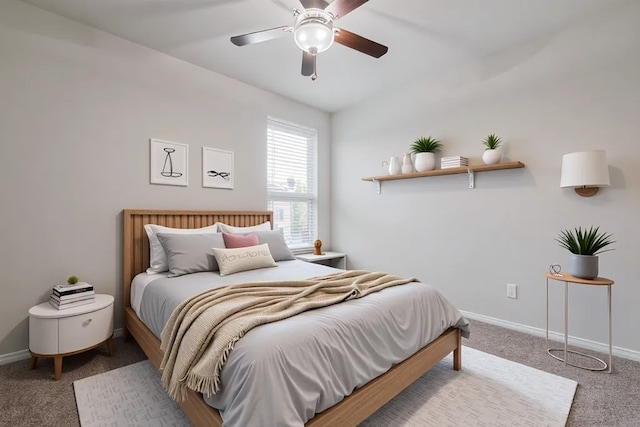 8326 Erasmus Landing Ct, Houston, TX 77044 - carpeted bedroom featuring baseboards and a ceiling fan