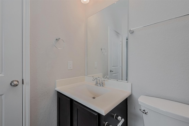 8326 Erasmus Landing Ct, Houston, TX 77044 - half bathroom featuring vanity and toilet