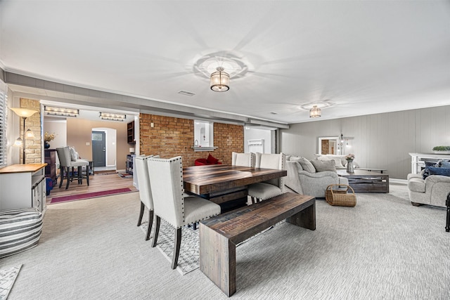 5406 Hazel St, Baytown, TX 77521 - dining space with light colored carpet and brick wall