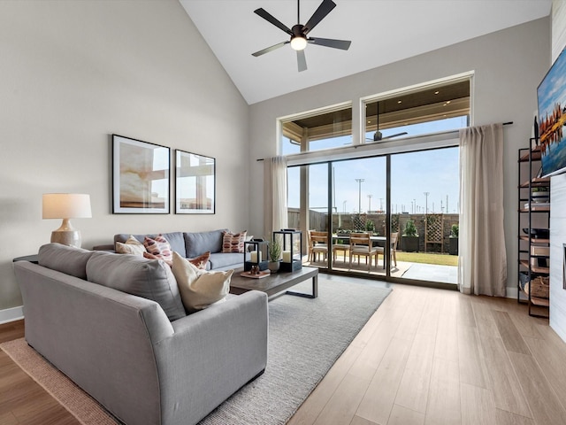 14931 Clover Meadow Ln, Montgomery, TX 77316 - living area with high vaulted ceiling, ceiling fan, and wood finished floors