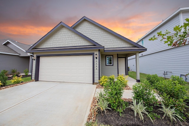 2569 Hawks Eye Dr, Conroe, TX 77301 - view of front of home featuring a garage, concrete driveway, and covered porch